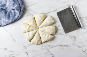 Divided dough cut into equal pieces before shaping.