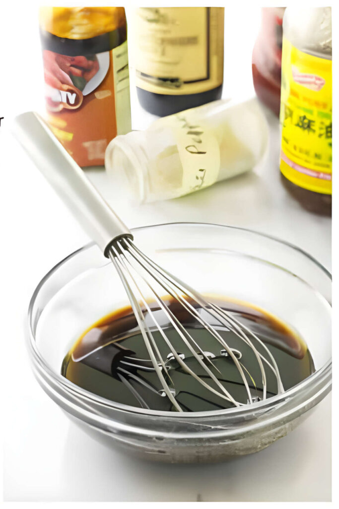 Whisking pantry ingredients to make homemade sauce.