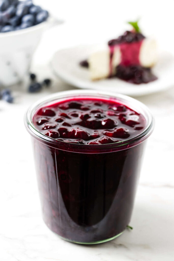 Thick blueberry topping with whole berries in a bowl.