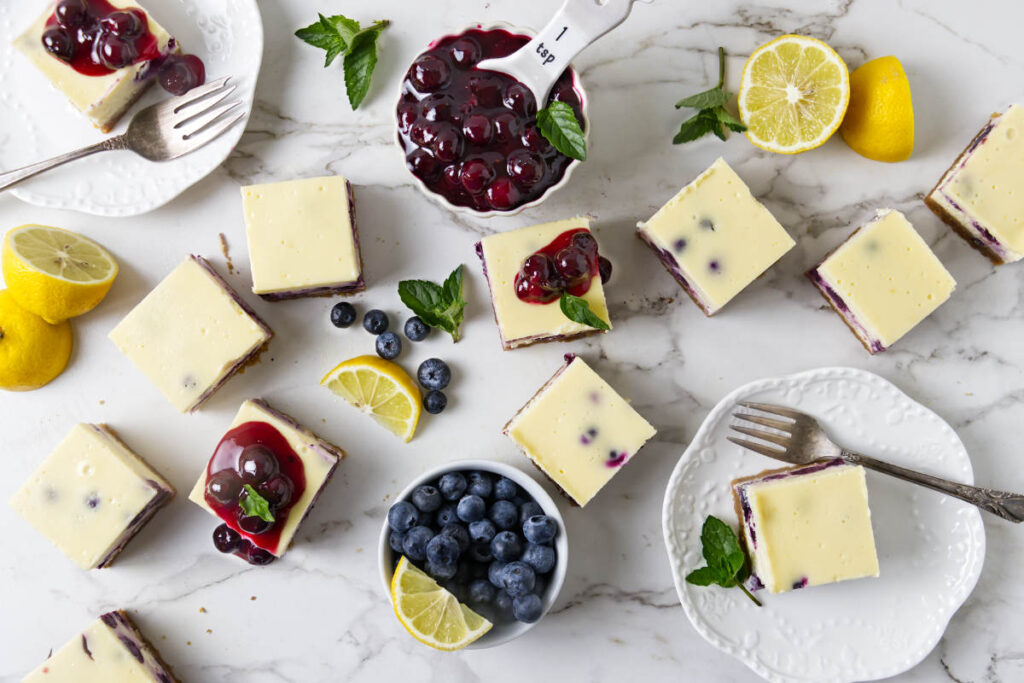 Blueberry cheesecake bars with lemon filling and whole blueberries.