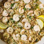 One pot shrimp and orzo served with lemon and parsley.