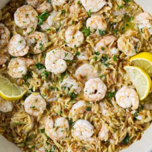 One pot shrimp and orzo served with lemon and parsley.