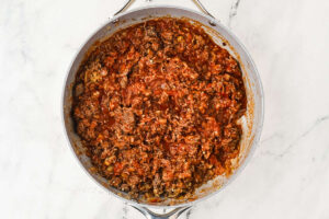 Thick meat and marinara filling in a skillet.