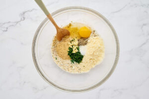 Breadcrumb panade mixed with egg, Parmesan, parsley, garlic, and seasonings for tender meatballs.