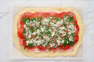 Pepperoni, salami, ham, parsley, and Parmesan layered over stromboli dough.