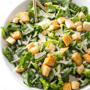 Caesar salad with romaine lettuce, croutons, and shaved parmesan cheese.