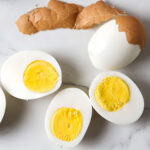 Peeled and sliced hard-boiled eggs.
